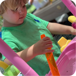 Child playing with outdoor water toy.