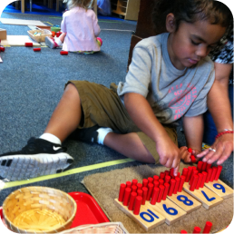 Child playing with educational counting blocks.